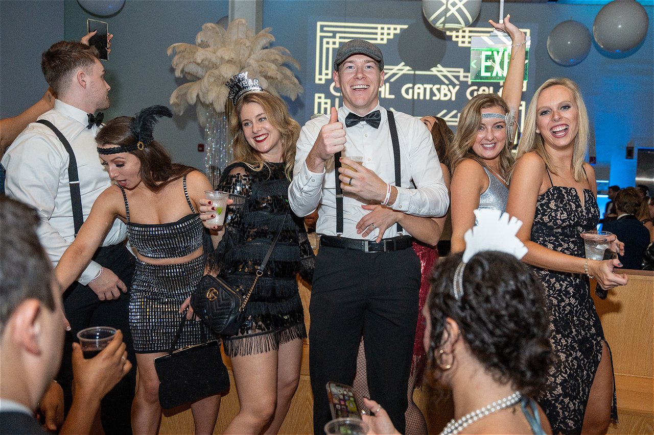 A group dressed up in full Great Gatsby Roaring Twenties theme for the Capital Gatsby New Year's Eve DC Gala.