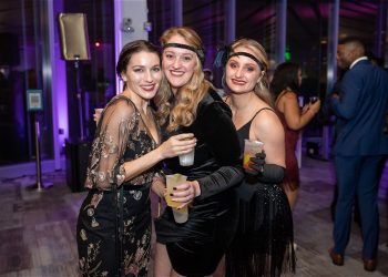 3 ladies dressed up in Great Gatsby theme at the Capital Gatsby New Year's Eve DC Gala 2022 - 2023 at HQO in Washington, DC.