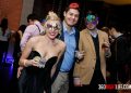 1 woman in a black dress showing off her leg and 2 men standing next to her. All 3 have masquerade masks. The woman is on the right and is wearing the mask the guy in the middle has a blue shirt and his masquerade mask is sitting on top of his head. The man on the far right has his masquerade mask on and it is colorful. This picture was taken at National New Year's Eve Masquerade Ball by 360 Nightlife in Washington, DC. The original website was http://www.360nightlife.com but we have revamped to https://www.360nigthlife.com. Please note: all rights reserved. These photos are sole copyright of 360 Nightlife & should not be used without permission or attribution.