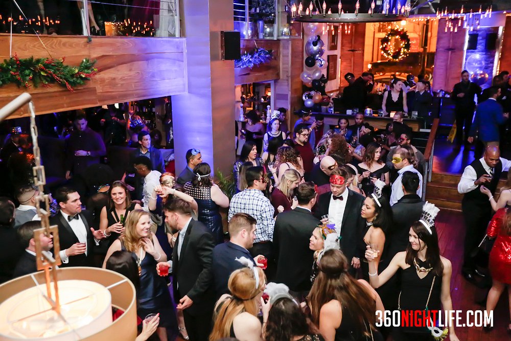 A beautiful crowd at National New Year's Eve Masquerade Ball by 360 Nightlife. This was a NYE DC event and the picture showcases many people dancing and having fun in Masquerade Masks. There are also VIP tables surrounding the left side. Note: https://www.360nightlife.com has now been revamped to https://www.360nightlife.com. All rights are reserved. These pictures should not be reproduced without 360nightlife.com permission.